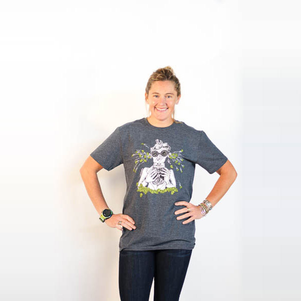 Female modeling heathered grey Focal Banger logo tee. Logo hops are lime green. Rest of design is black and white. Front view.