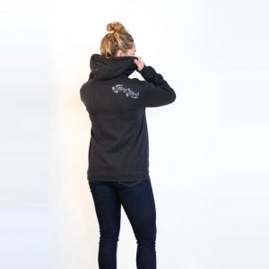 Female modeling charcoal grey zip Heady Topper hoodie. Back shows stylized Heady Topper text. Back view.