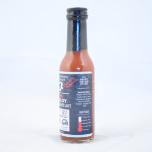 Five ounce red hot sauce bottle with black label.