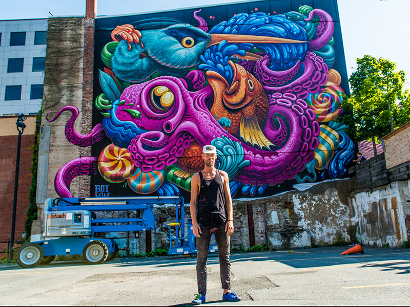 Click to view Eleri Harris' artist website. Image by Eleri Harris of John Kimmich drinking beer from pint glass.