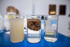 Three different stages of the pretreatment process. The product on the right is what is discharged back into the municipal sewer system.